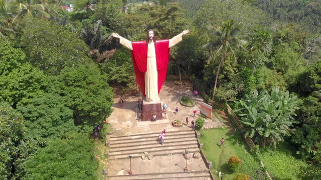 Aerial drone footage of beautiful salute Jesus at Kamay ni Hesus healing Catholic church.