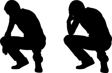silhouettes of worried men crouching
