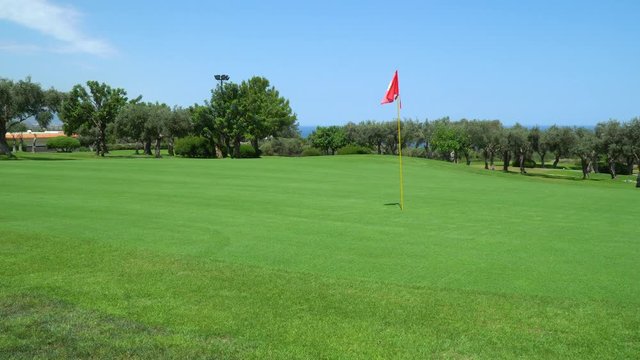 golf course, Cyprus, olive trees, green pastures, strong wind, hole