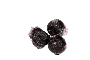 frozen berries on white background, black currant, isolated
