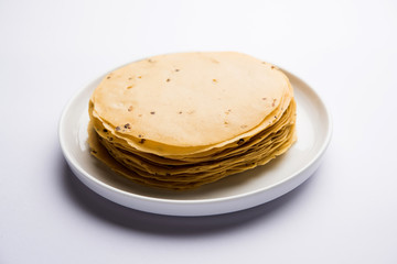 Gujarati papad or papadum in raw dried form with roasted cone, roll and flat variation