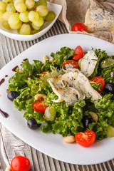 salad provence with blue cheese on wooden table