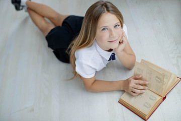 Fashion school. A girl is reading a book. 