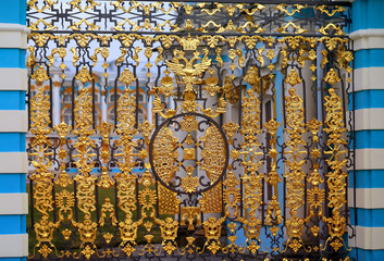 Photo of the golden ancient gate in the suburb of St. Petersburg