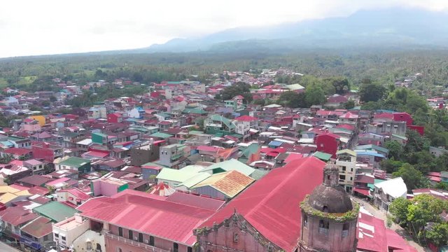 Aerial Drone footage of beautiful vintage Saint John the Baptist Parish Church at Laguna, Philippines.