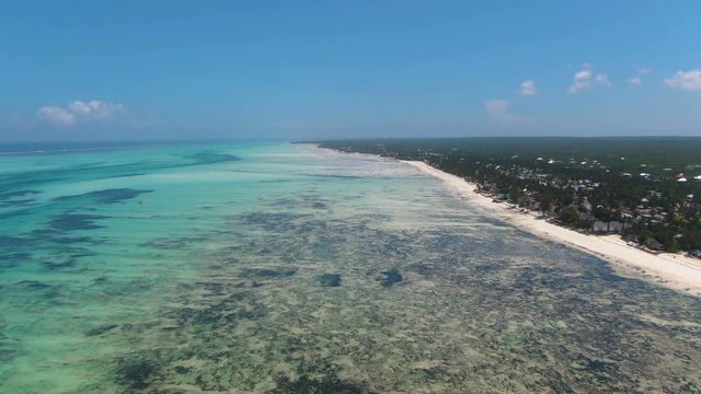 Aerial view of ocean and coastline of Jambiani in Zanzibar island
