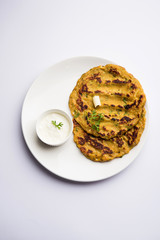 Thalipeeth is a type of savoury multi-grain pancake popular in Maharashtra, India served with curd/butter or ghee