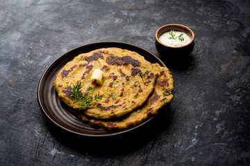 Thalipeeth is a type of savoury multi-grain pancake popular in Maharashtra, India served with curd/butter or ghee