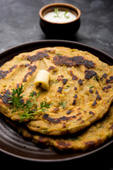 Thalipeeth is a type of savoury multi-grain pancake popular in Maharashtra, India served with curd/butter or ghee