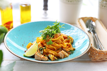 Tagliatelle with grilled salmon in a cream sauce with the addition of white wine