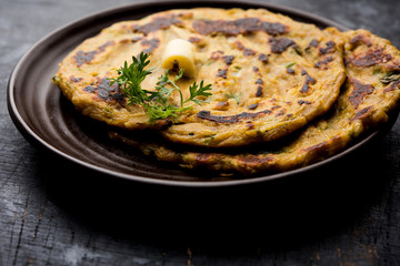 Thalipeeth is a type of savoury multi-grain pancake popular in Maharashtra, India served with curd/butter or ghee
