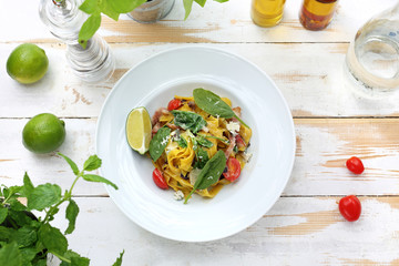 Tagliatelle with guanciale and gorgonzola with the addition of spinach and white wine.