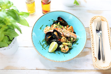 Pasta tagliatelle with seafood, prawns, mussels, langoustines, squid, with the addition of white wine