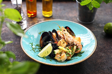 Tagliatelle with seafood, prawns, mussels, langoustines, squid, with the addition of white wine