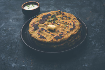 Thalipeeth is a type of savoury multi-grain pancake popular in Maharashtra, India served with curd/butter or ghee