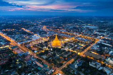 Aerial view drone shot of  Bangkok night light with golden mountain Wat Saket,Thailand