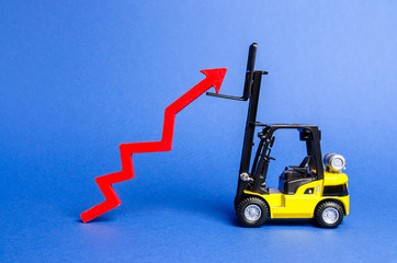 A yellow forklift raises a big red arrow up. Growth in production rates and development of industry and infrastructure. Increased sales, economy growth. Concept of increase, growth and success.