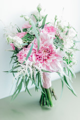 Wedding bouquet with pink flowers and succulents