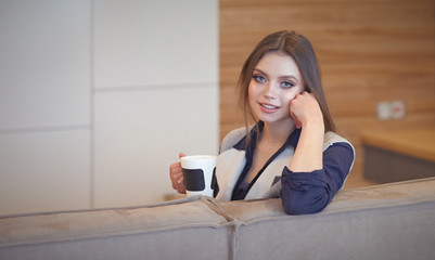beautiful girl resting on a chic couch