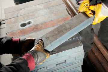 workers and heavy metal blocks