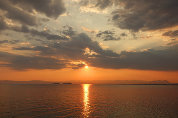 Beautiful sunset with clouds over the Aegean sea