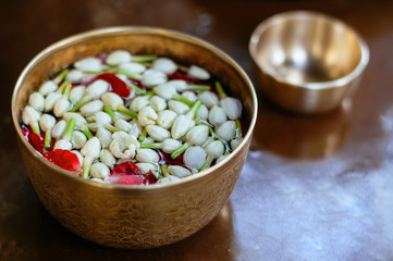 Thai culture water dipper bowl with jasmine and flowers for greeting or Songkran day