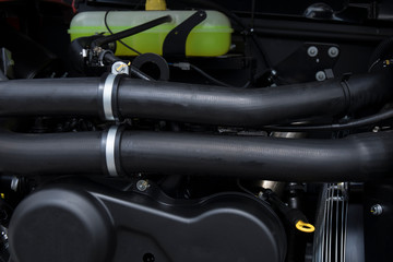 Obraz premium Element of engine system of new modern agricultural tractor or combine or harvester