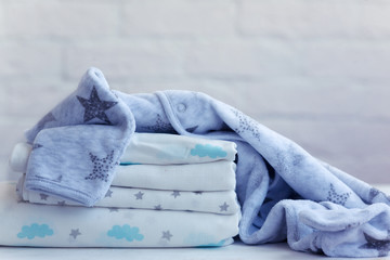 set for a boy, muslin diaper, fleece pajamas, background. © tata_cos