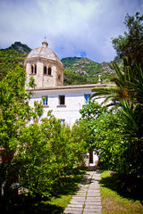 Naklejka premium SAN FRUTTUOSO, ITALY - The old abbey from 10th century, view from the quiet garden