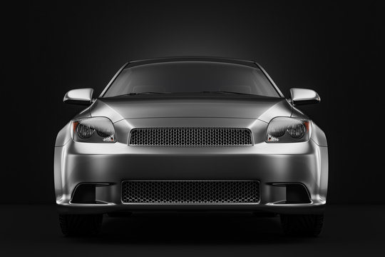 Front view of  gray metallic sport modern car in black studio.