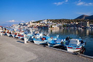 Fototapeta na wymiar Fishing boats in Elounda (Crete, Greece). Elounda is a small fishing town on the northern coast of the island of Crete, Greece.