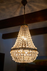 Old crystal chandelier with beautiful light.