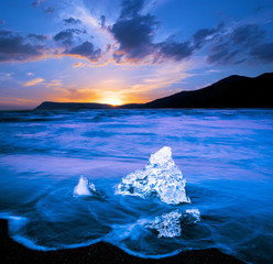 magical charming beautiful landscape with a piece of ice like a sculpture on the Diamond beach near...