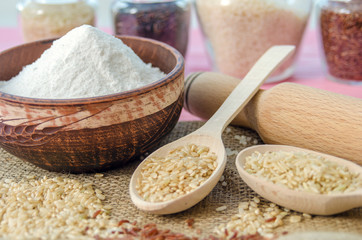 Assortment of different rice in bowls: white rice red rice black rice a mixture of wild and brown rice. The whole grain of rice. unpolished rice. Healthy food background.