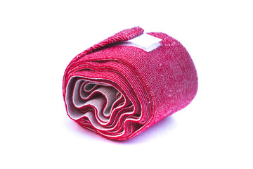 Red elastic bandage on a white background