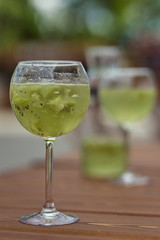 Glass with green summer cocktail
