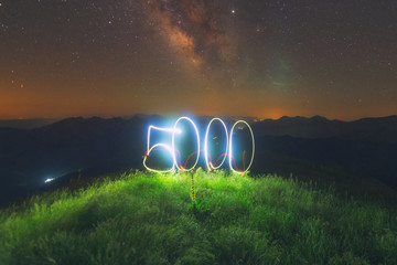 5000 in light painting under the milky way