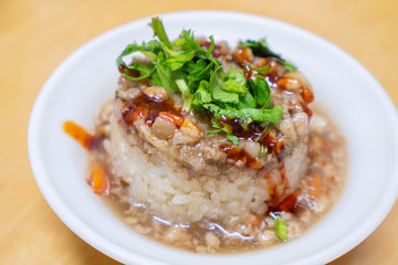 Rice pudding (Tube rice cake), popular delicious taiwanese street food gourmet delicacy, made by glutinous rice and pork with sweet chili sauce.