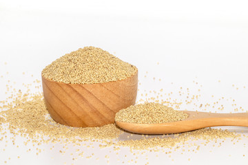 Organic Healthy millet in wooden spoon isolate on white background.