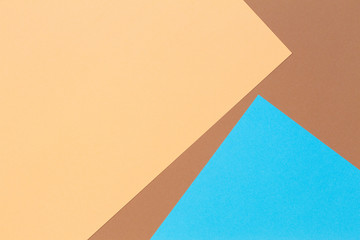 Color papers geometry composition background with beige, brown and light blue tones