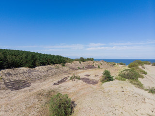 Curonian Spit and the Baltic Sea. View from the copter. Coastline with the beach and the sea. Nature conservation. View from the sky. The photo was taken by drone quadcopter.