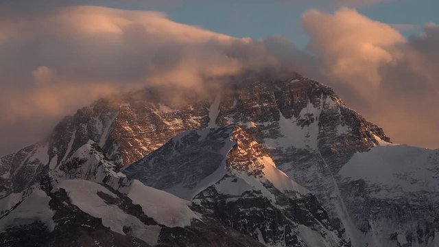 Time lapse of clouds moving over summit of Mount everest at sunset
