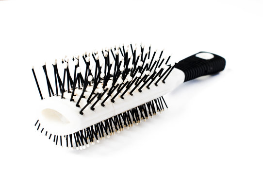 recommend clip art: White comb with black handle isolated on white background, copy space