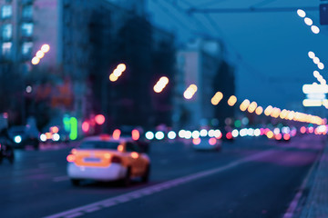 Abstract blurred image of urban street night traffic, yellow taxi with bokeh lights, night time,...