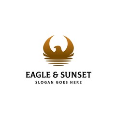 Eagle head and wings combined with sunset scene logo design
