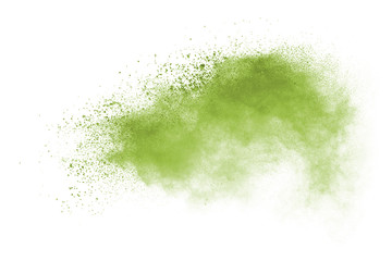 Green powder explosion on white background.