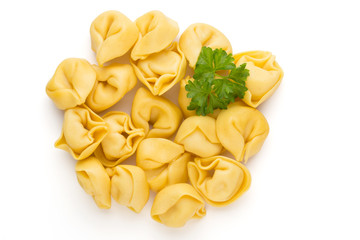 Raw homemade pasta,tortellini with herbs.