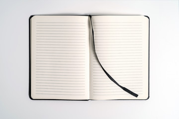 black notebook on white background with clipping path