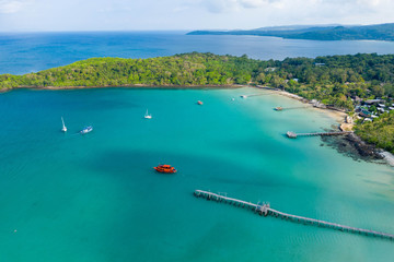 Aerial view. Beautiful tropical beach and wooden bridge in the sea in island Koh Kood Thailand