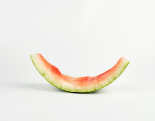 stub of red ripe round watermelon on a white background